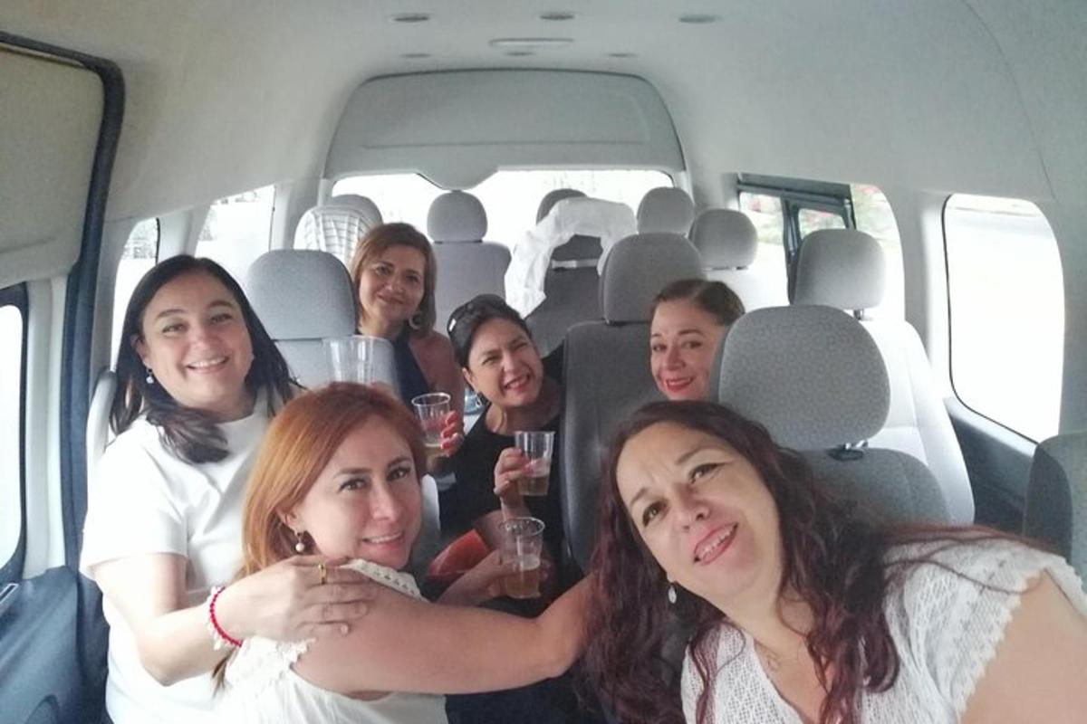 a group of people sitting in the back of a van