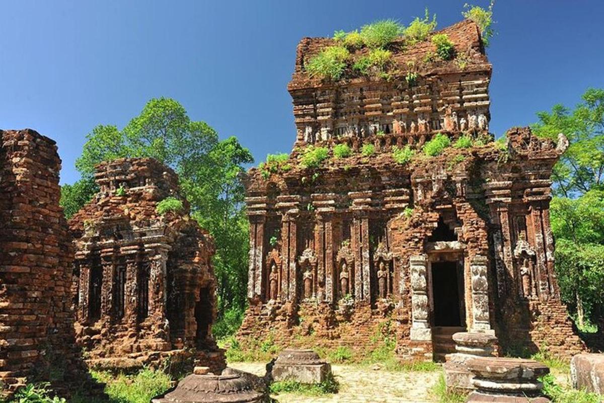 an ancient building with vegetation on top of it
