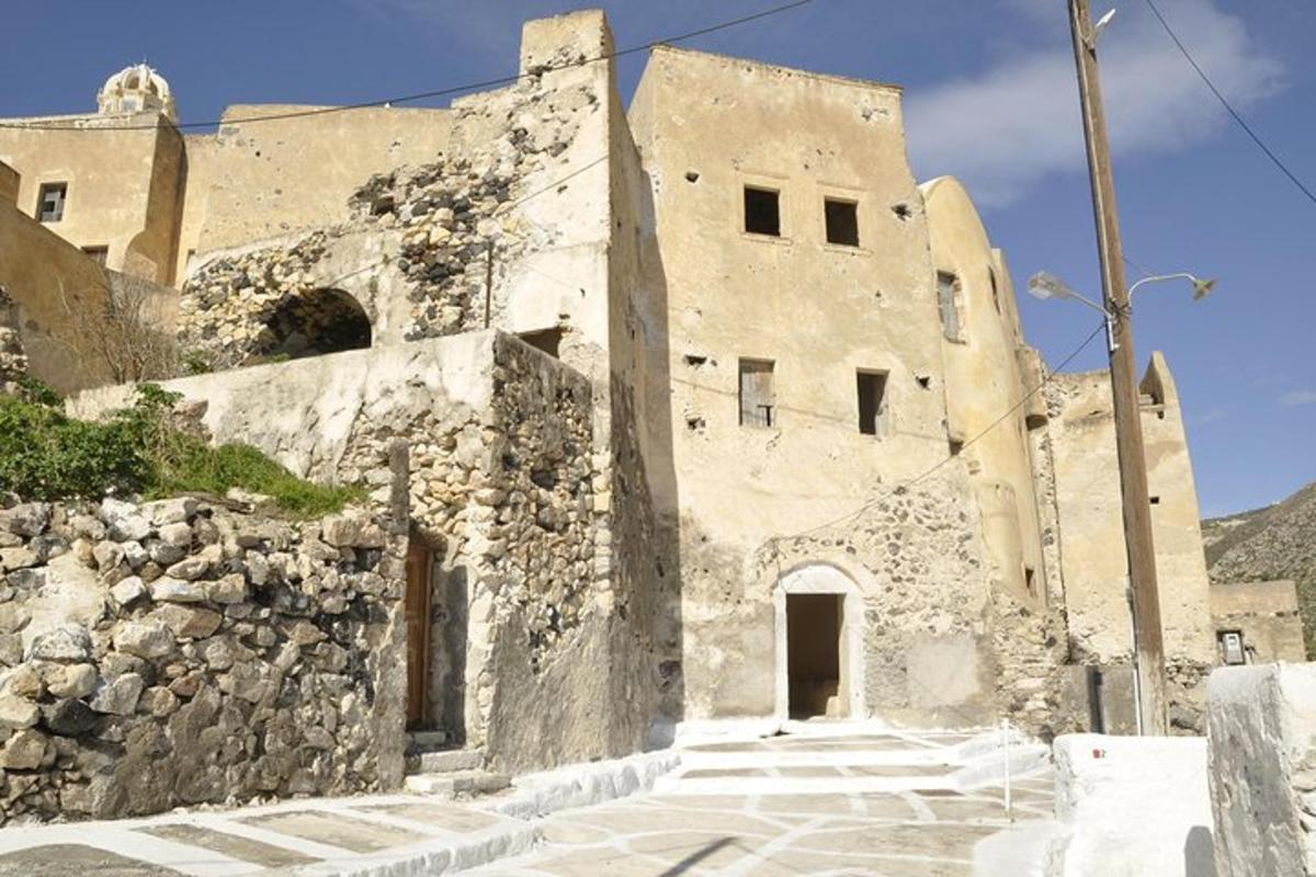 an old stone building with a stone wall
