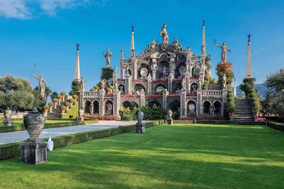 an ornate building with a green lawn in front of it
