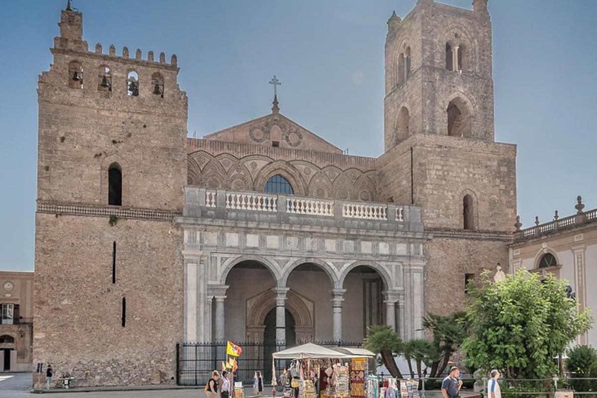 a large stone building with a tower and a church