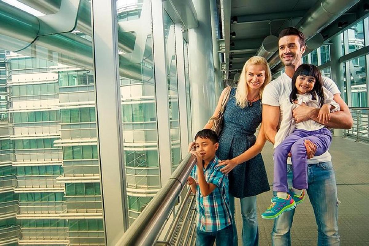 a family posing for a picture on an escalator