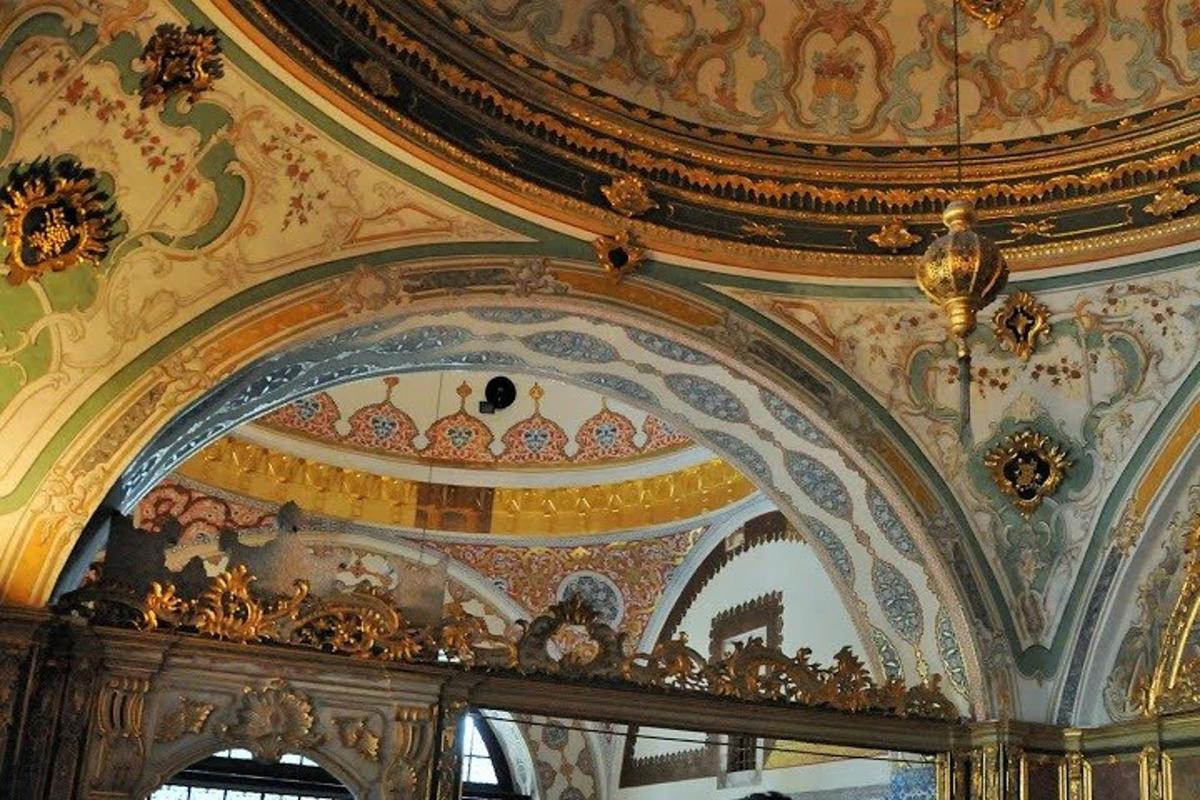 a room with a ceiling with paintings on it