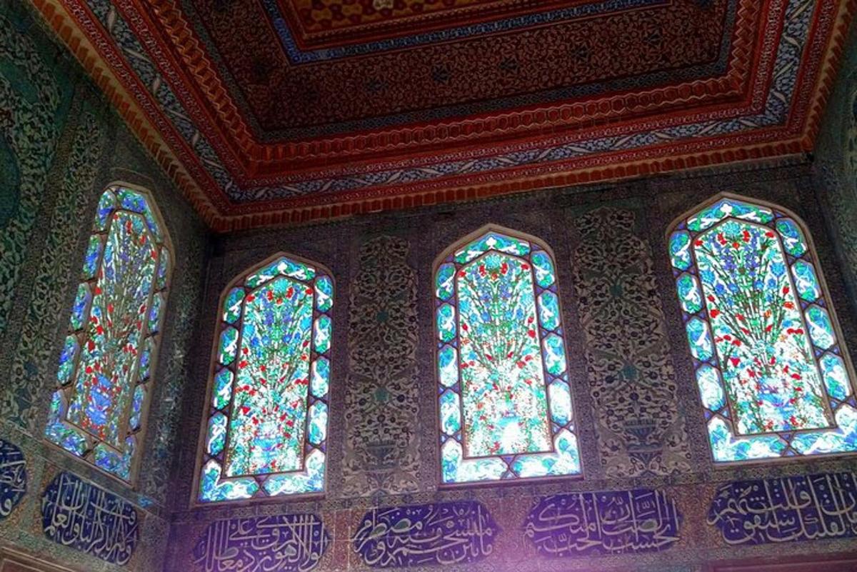 two stained glass windows in a room with a ceiling