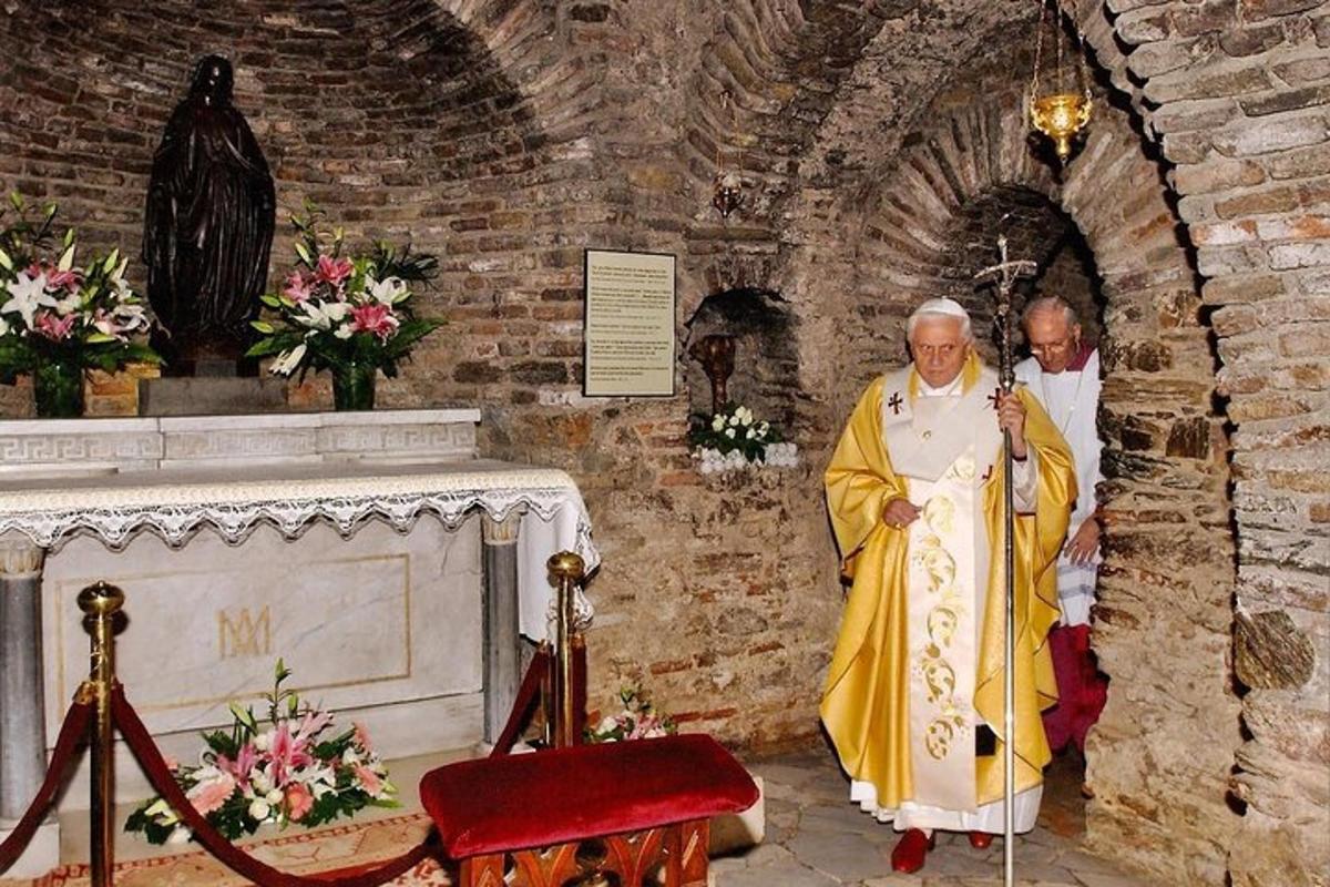 two priests standing in a church with a altar