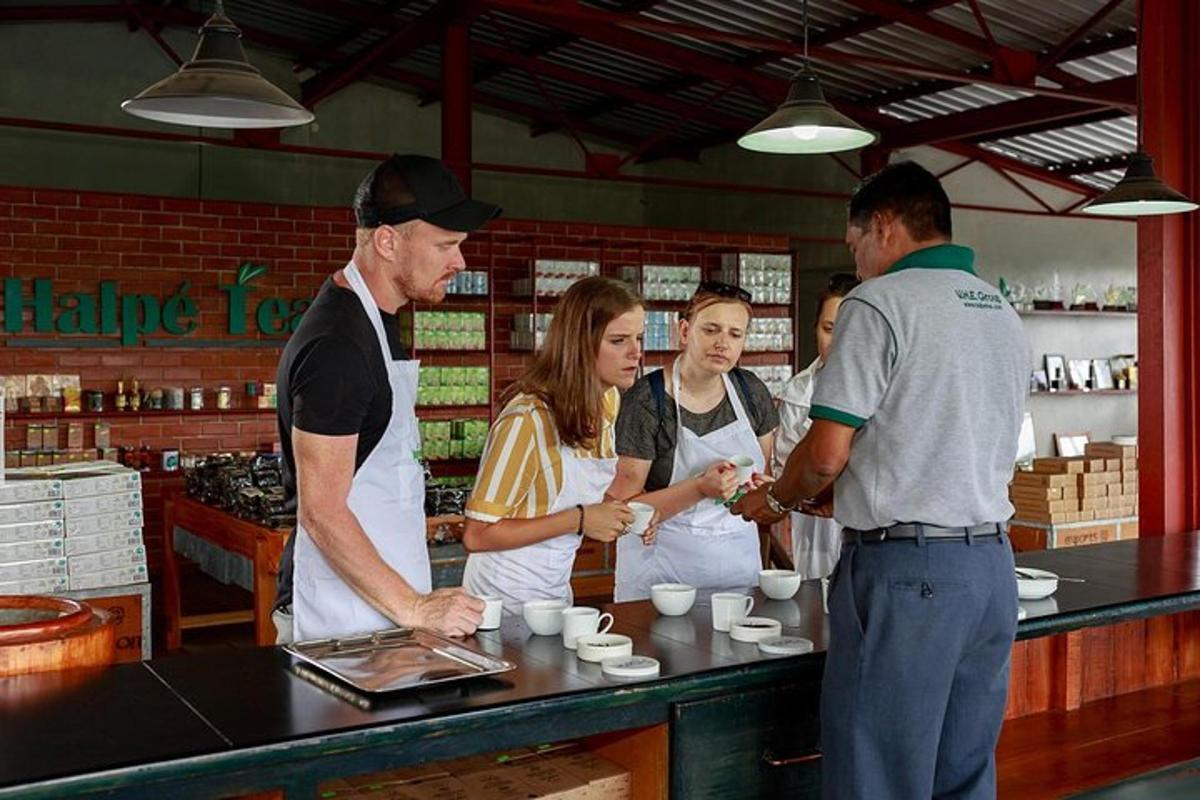 a group of people standing at a counter in a coffee shop