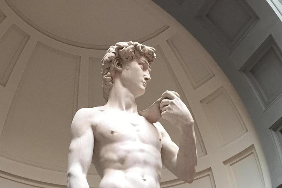 a statue of a man brushing his teeth