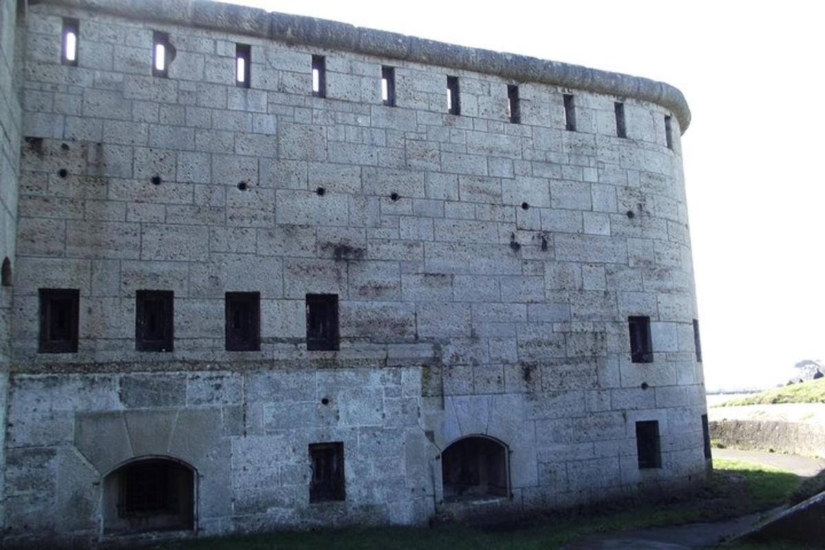 a large brick building with windows on the side of it