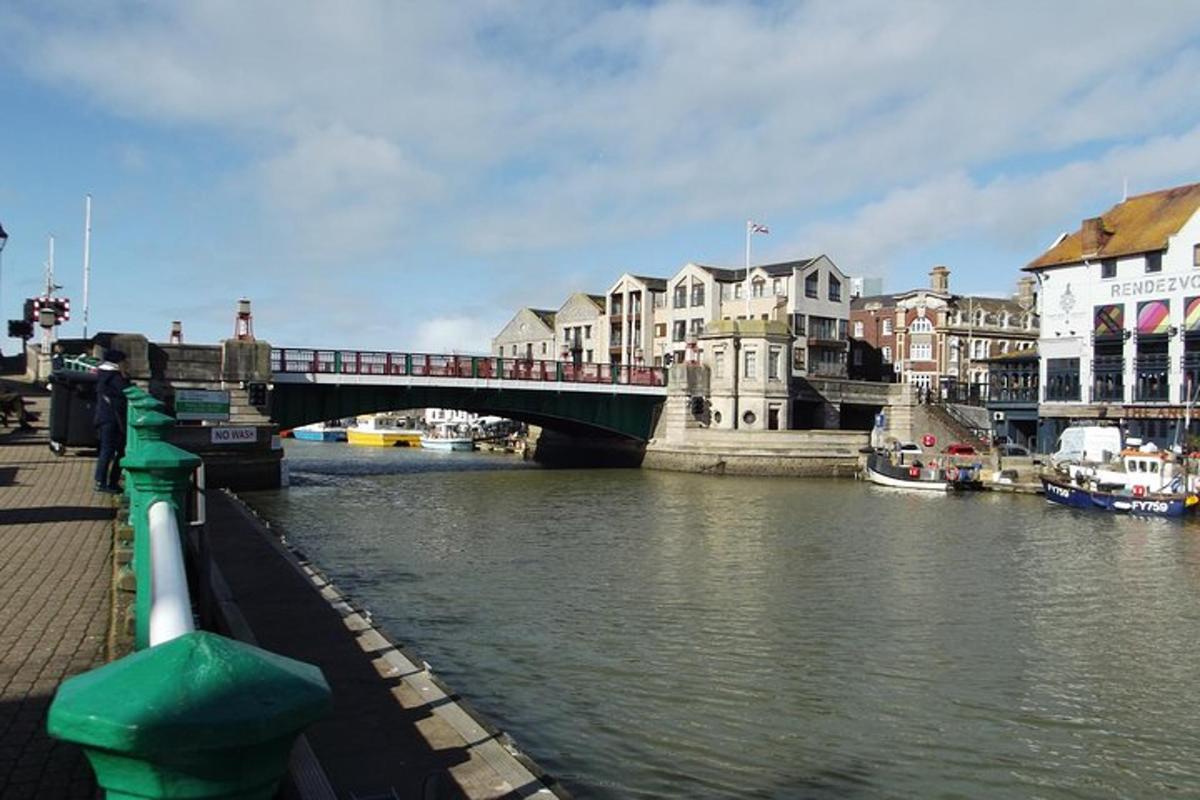 a bridge over a river in a city with buildings