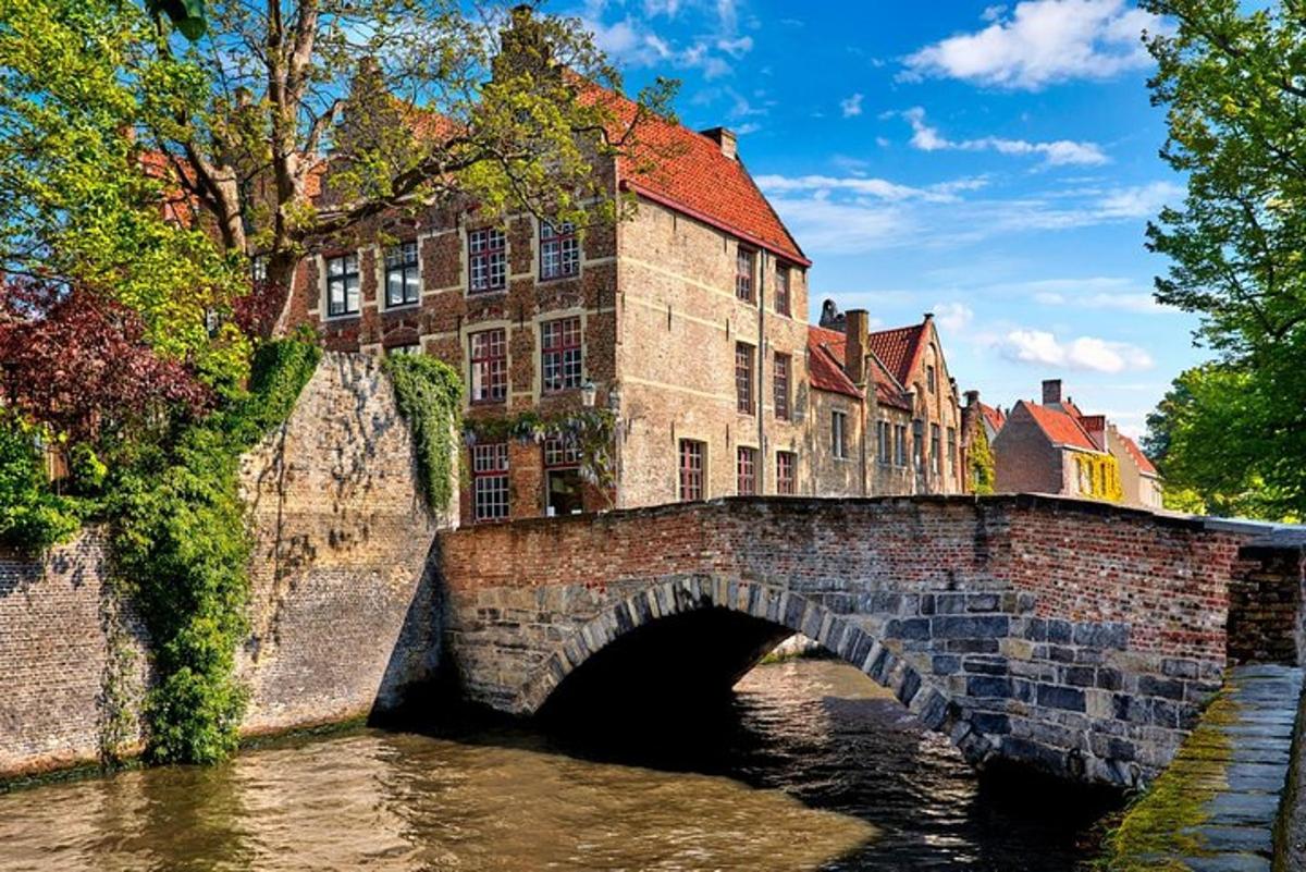 a stone bridge over a river in a city