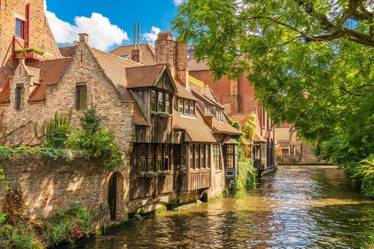 a river in front of a building next to a canal