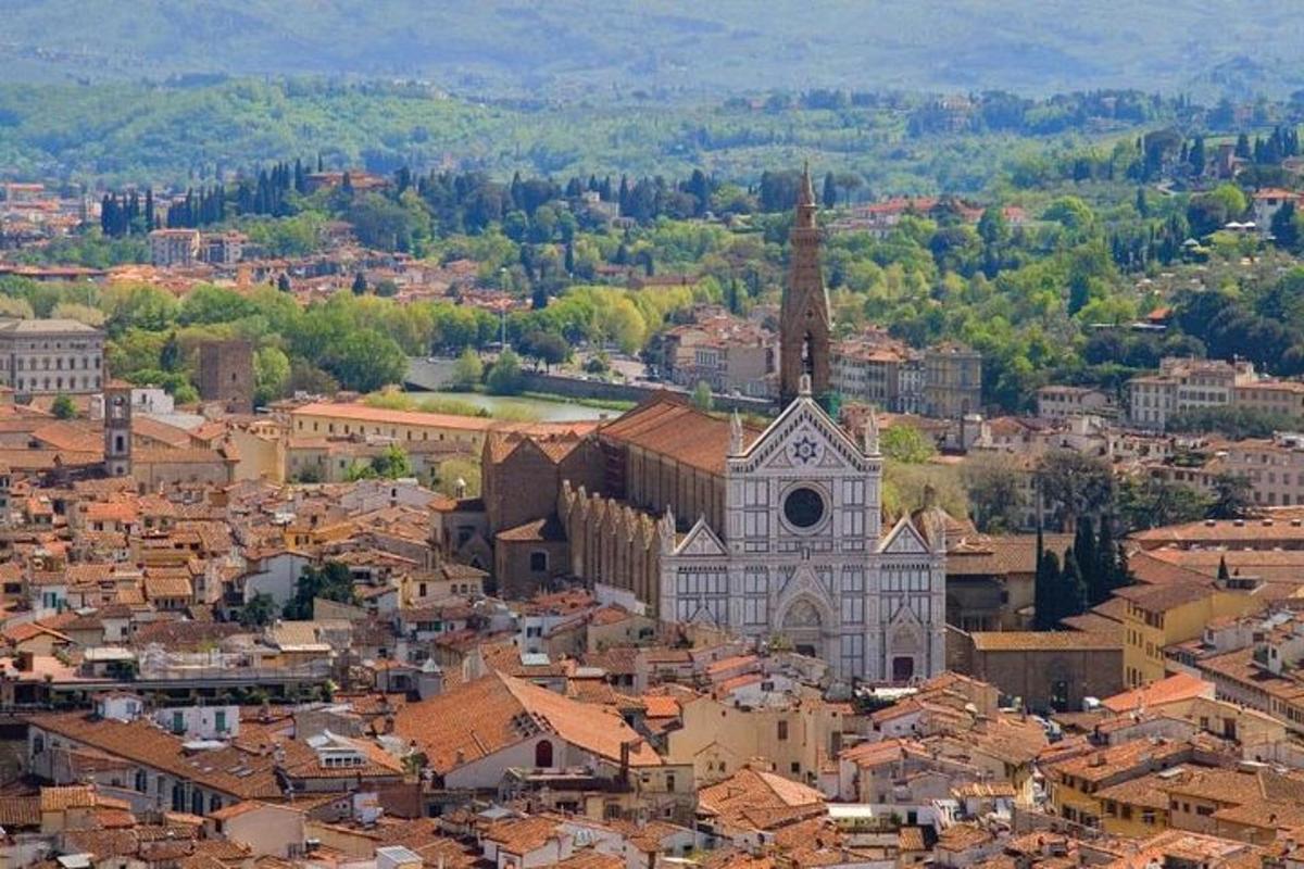 an aerial view of a city with a church