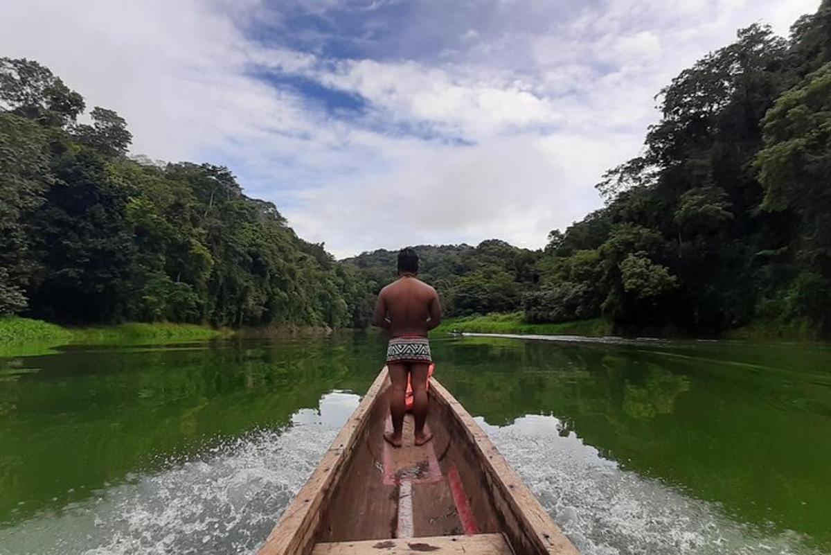 a man is riding a boat on a river