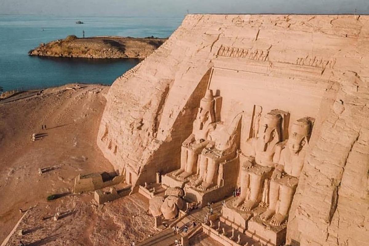 an aerial view of an ancient temple on a cliff
