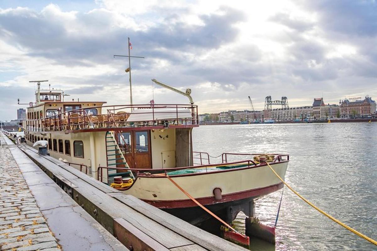 a boat is docked at a dock in the water
