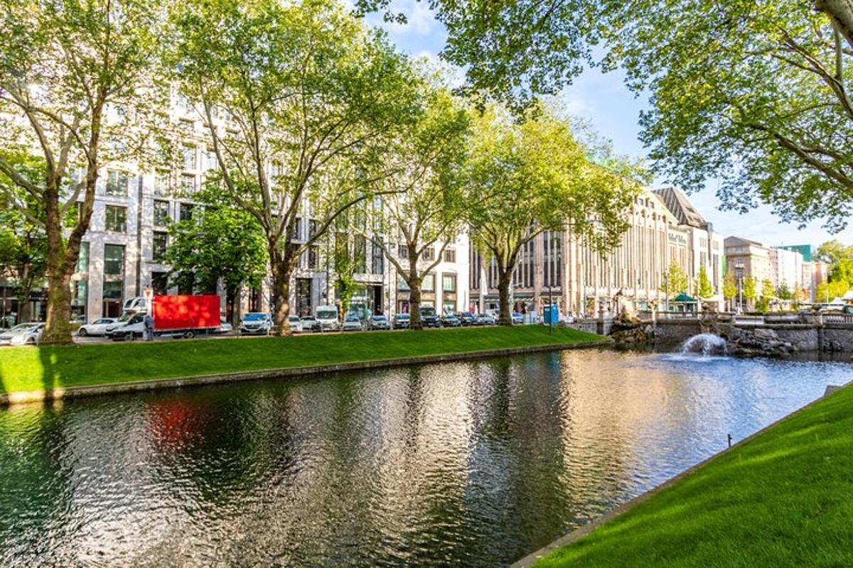 a river in a city with trees and buildings