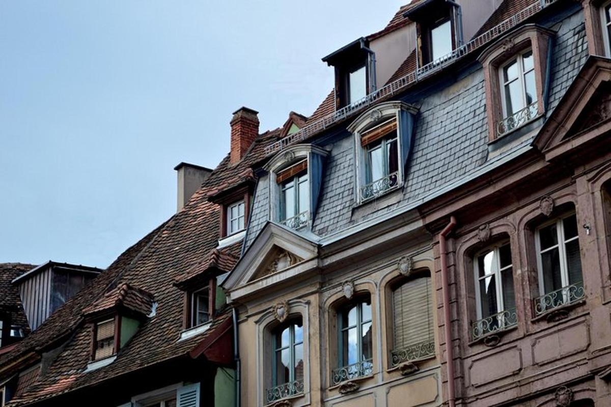 an old building with windows and a roof