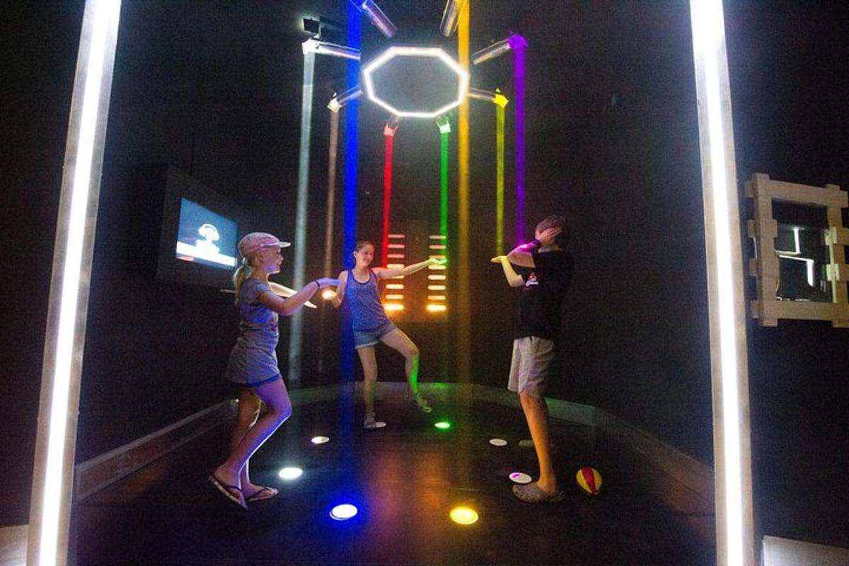 a group of people playing a game in an indoor gym