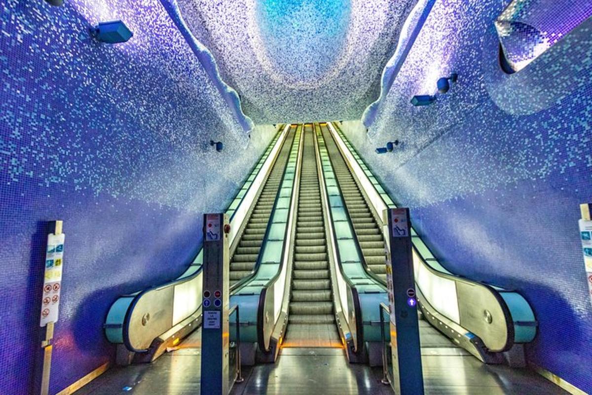 a view of an escalator in a subway station