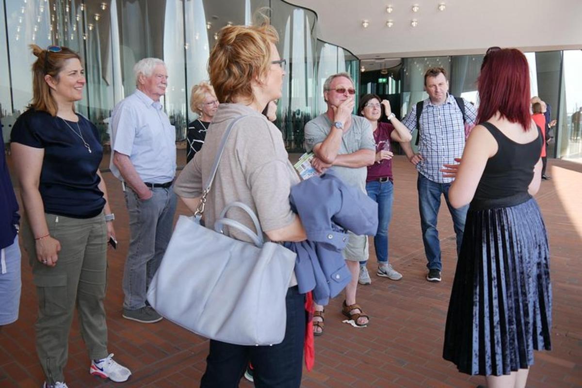 a group of people standing around in a mall