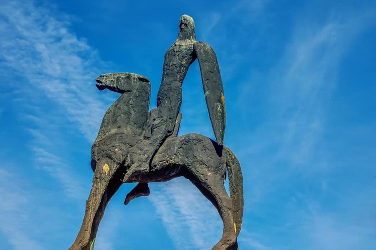 a statue of two birds on top