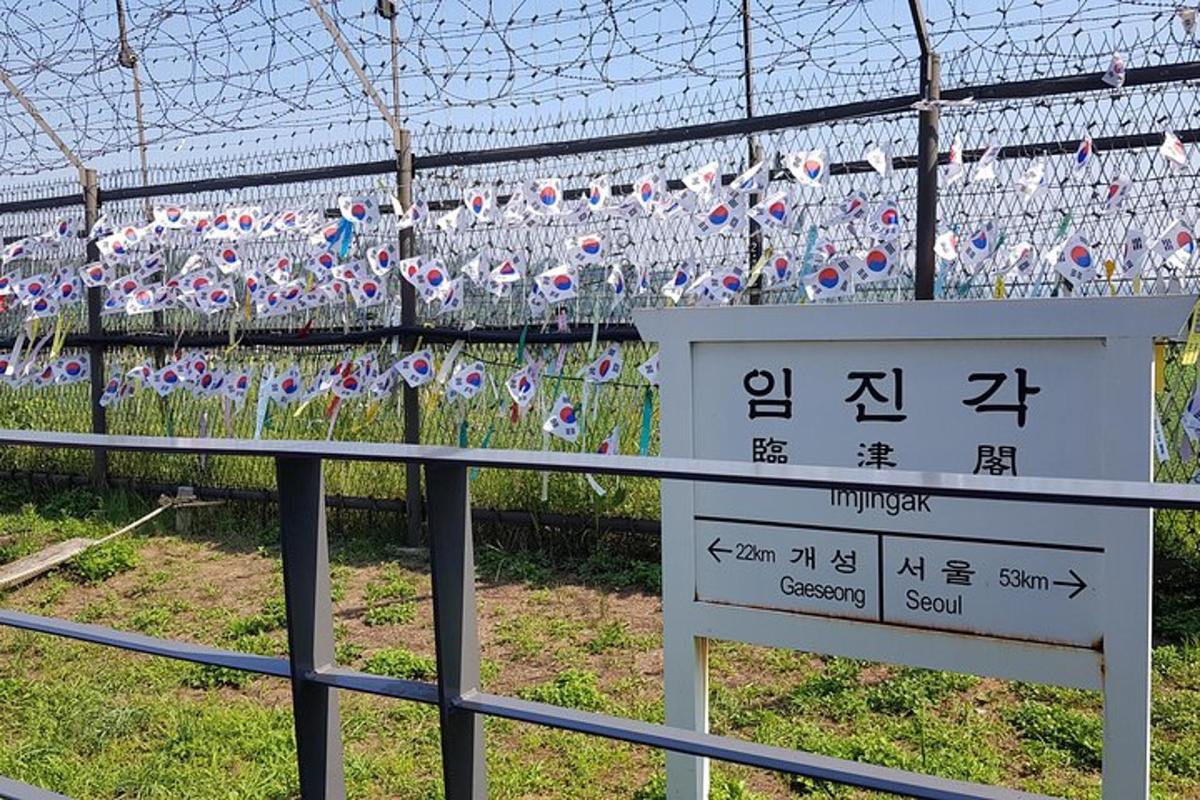 a fence with a bunch of tags on it