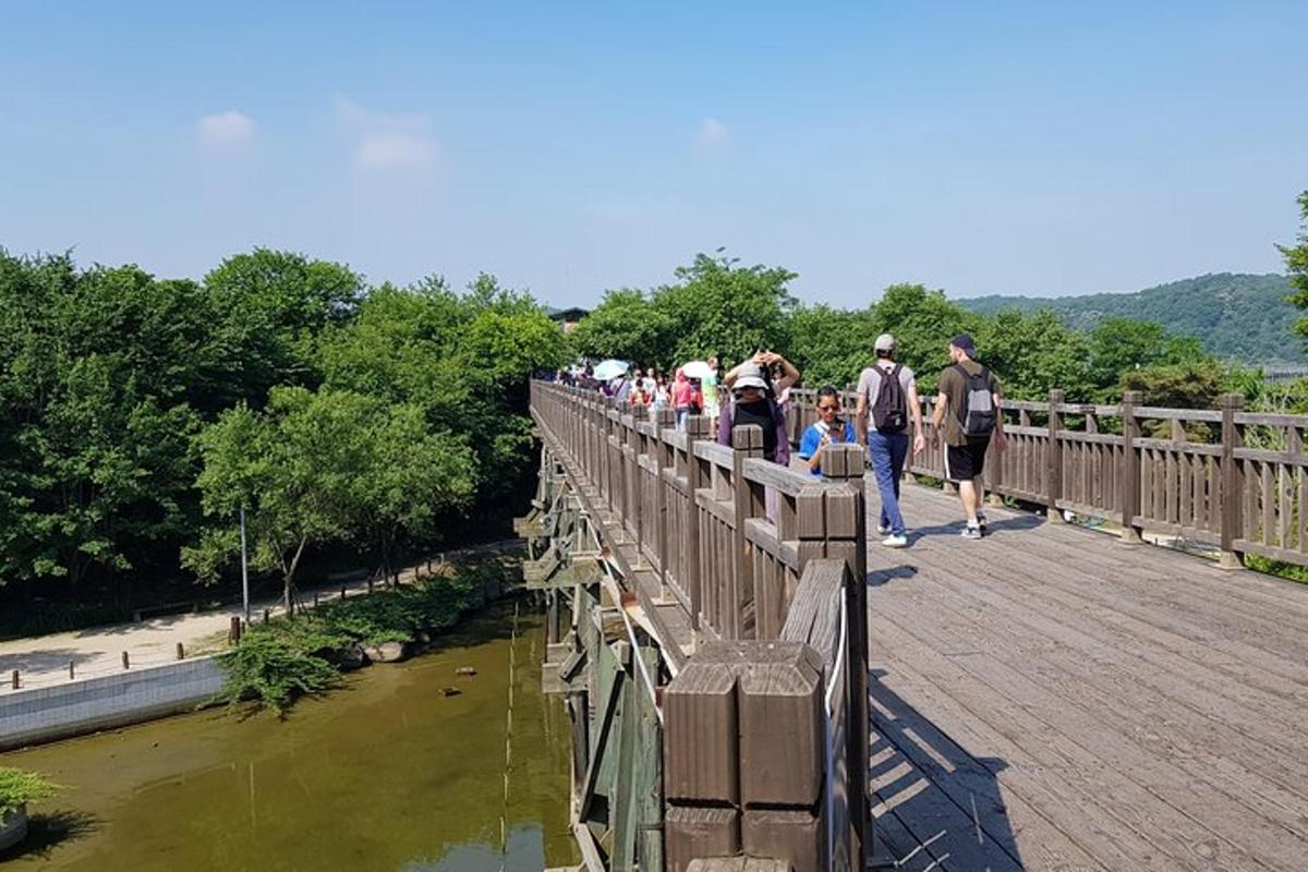 a group of people walking on a bridge