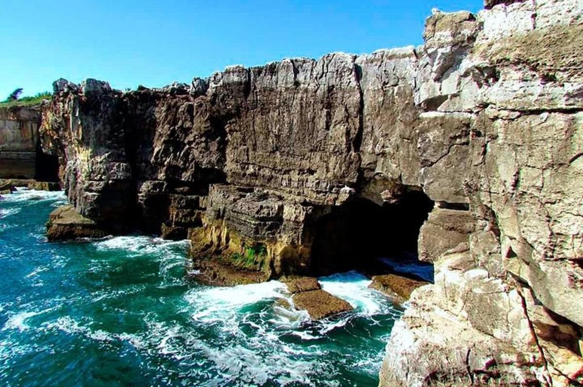 a view of a rocky coastline with the ocean