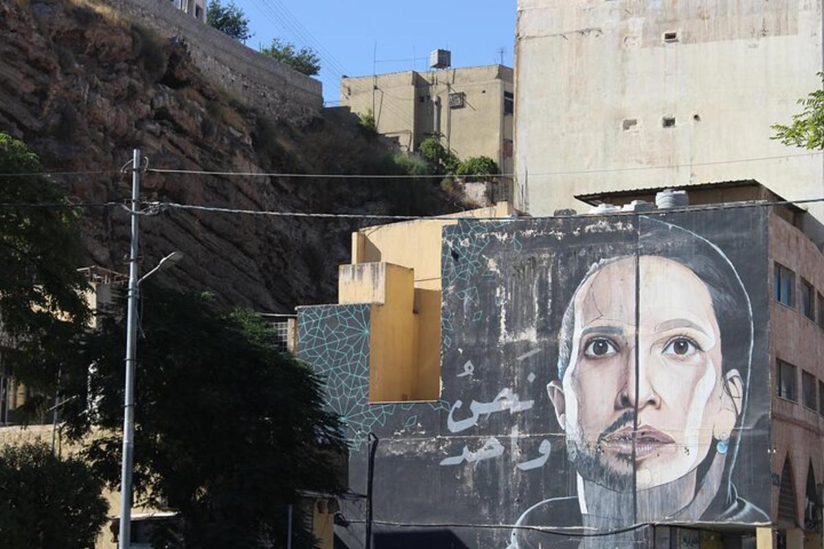 a large painting of a man on the side of a building