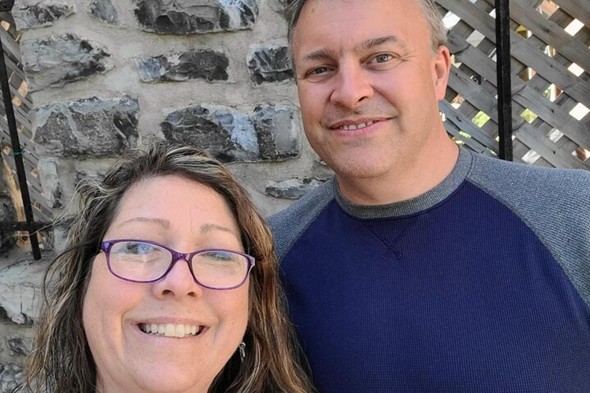 a man and a woman posing for a picture