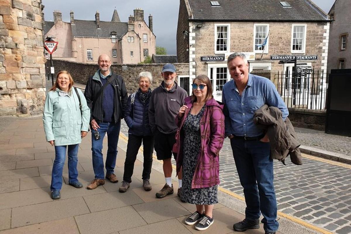 a group of people posing for a picture on a street