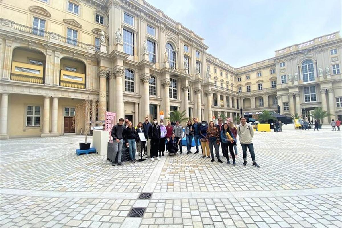 a group of people standing in front of a building