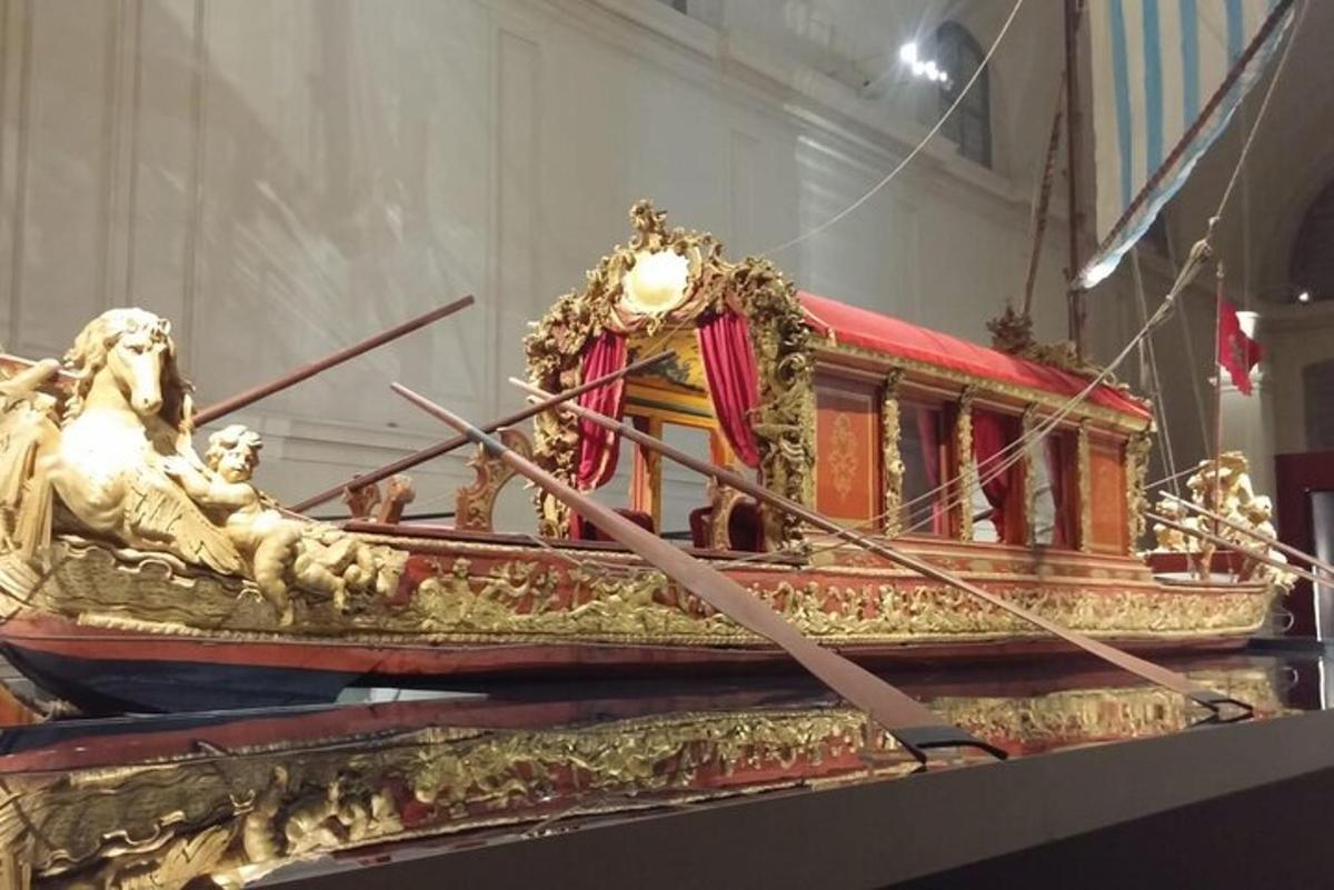 a statue of a boat on display in a museum