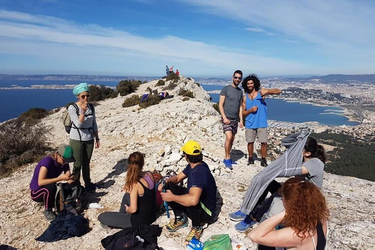 a group of people standing on top of a mountain
