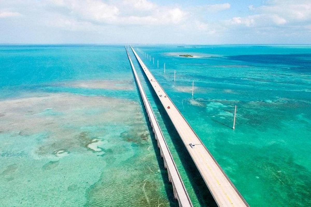 an aerial view of a bridge over the ocean