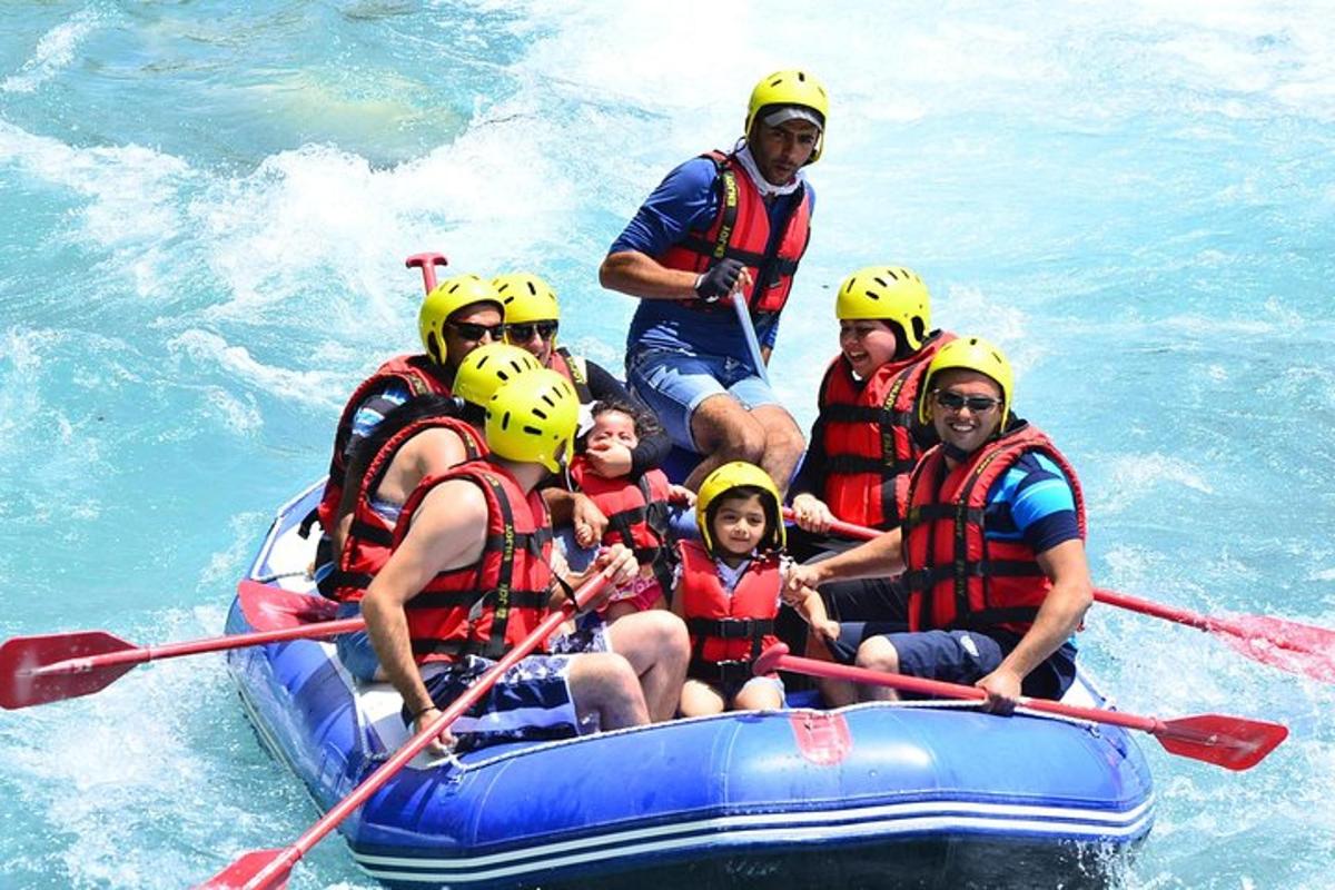 a group of people on a raft in the water