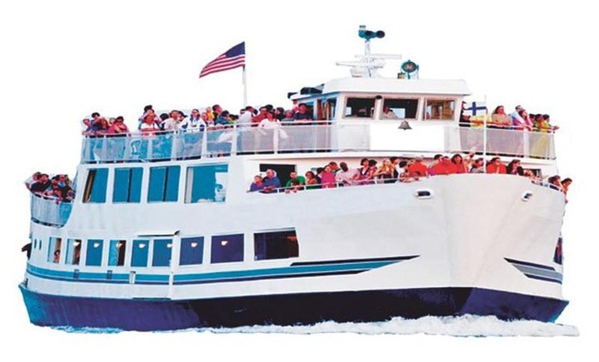 a group of people on a boat in the water