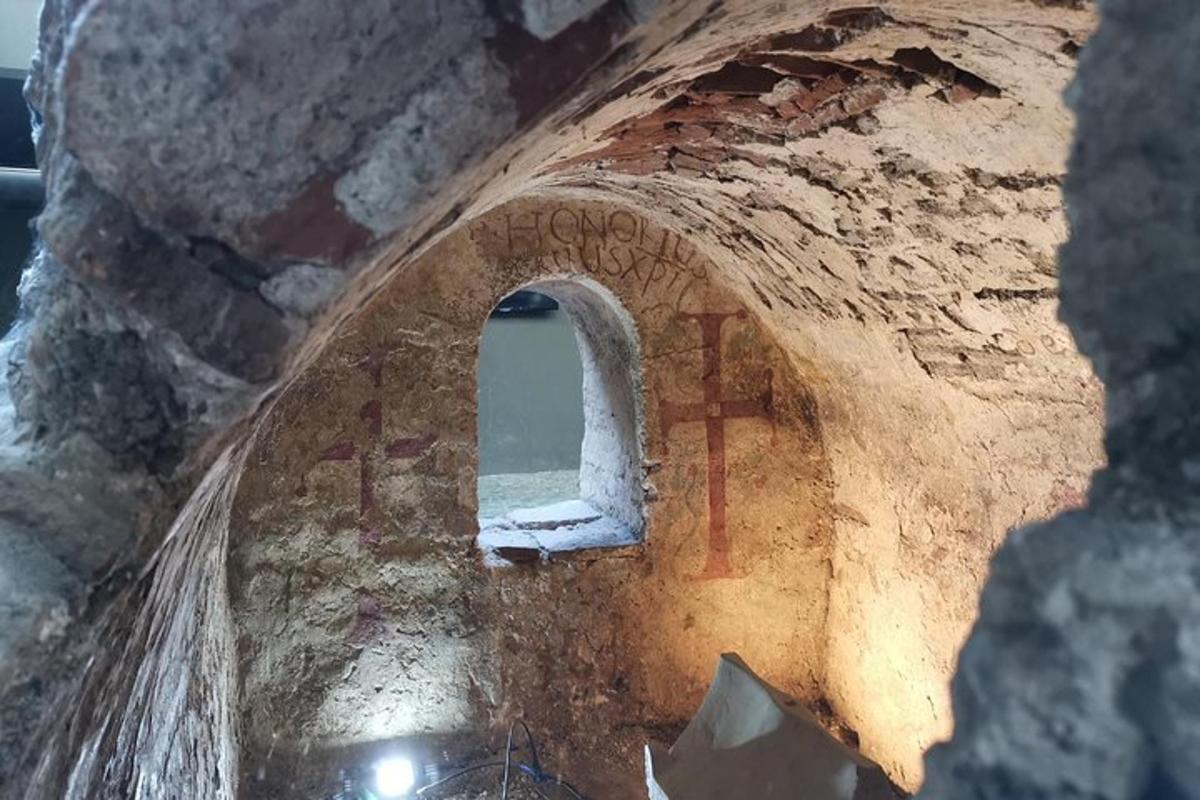 a view from the inside of a brick building with a window