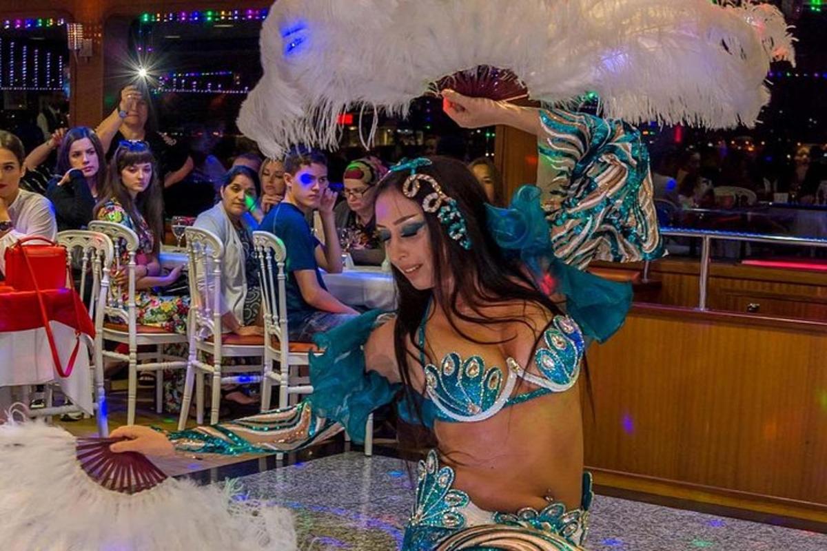 a woman in a mermaid costume in front of a crowd