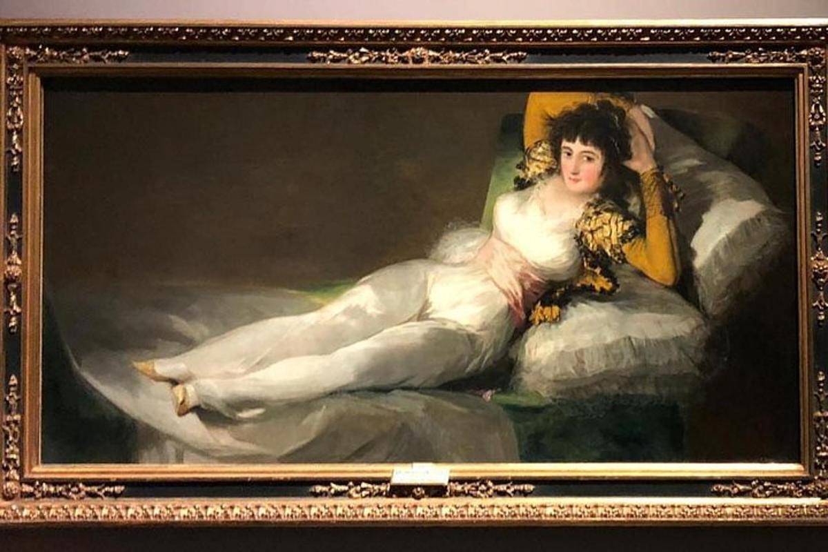 a painting of a woman laying on a pillow