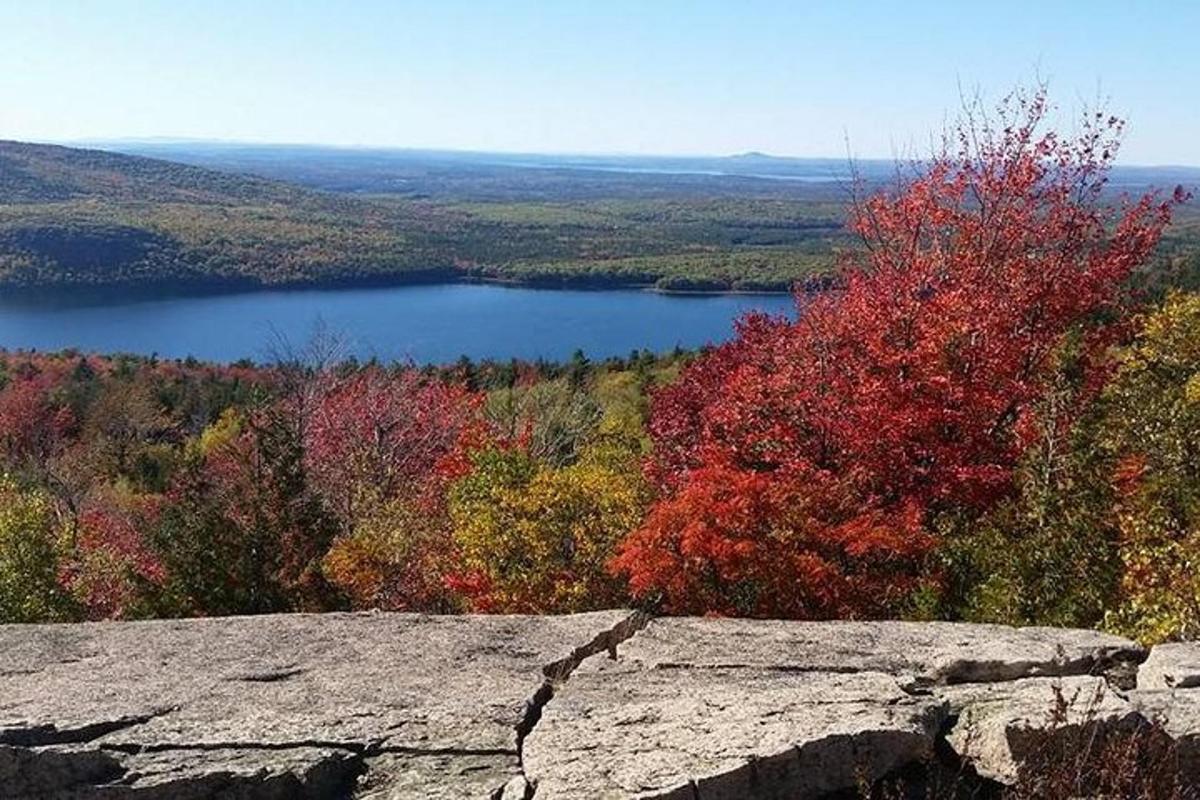 a view of a lake from top of a rock