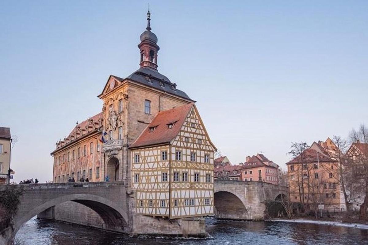 a building with a clock tower on top of a bridge