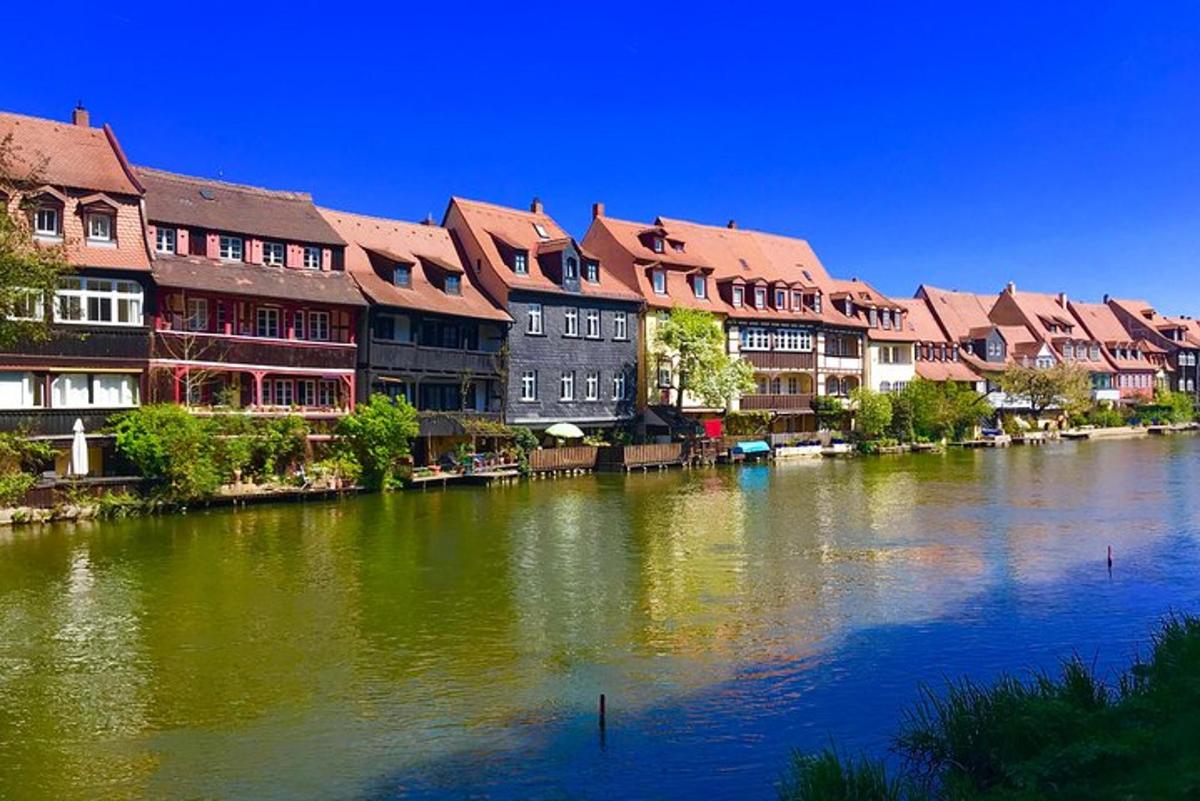 a group of buildings sitting next to a river