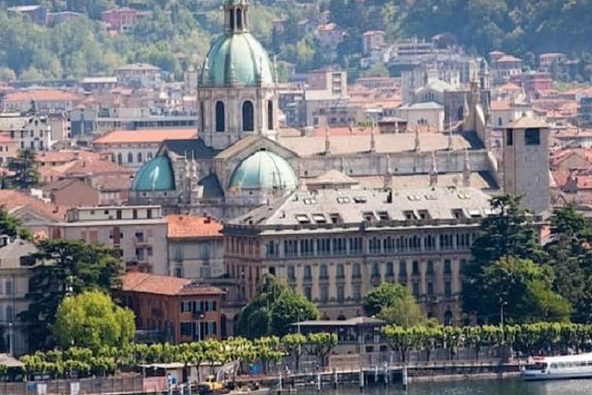 a large building with a green dome on top of it