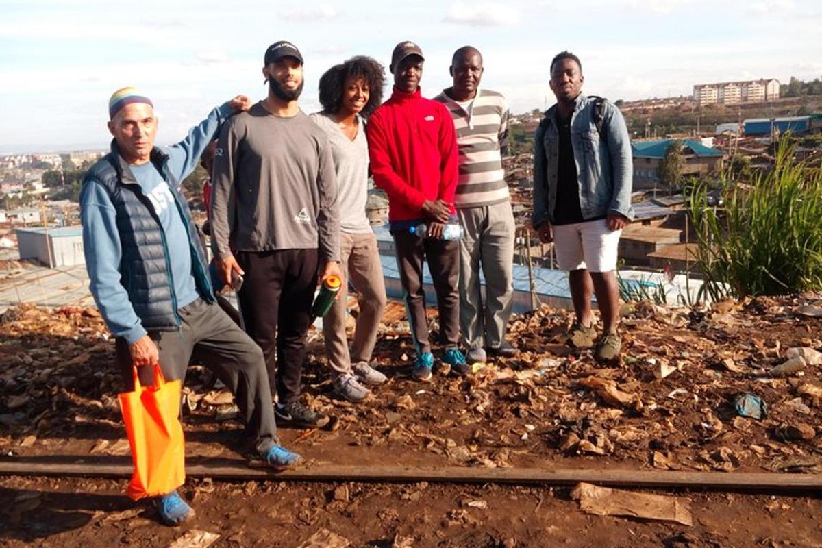 a group of people standing on top of a hill