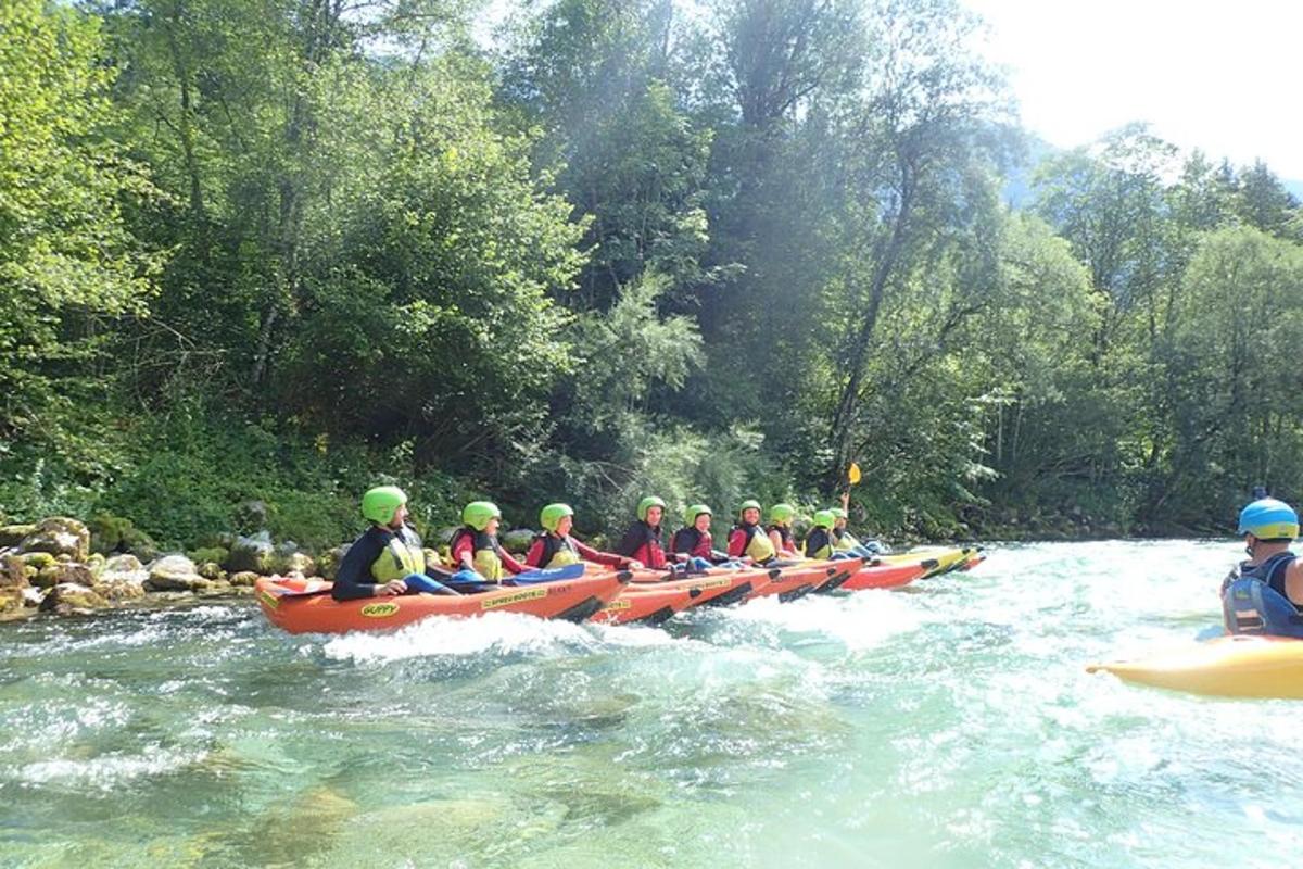 a group of people in kayaks on a river