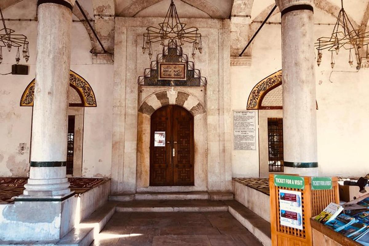 an old building with a clock on the wall