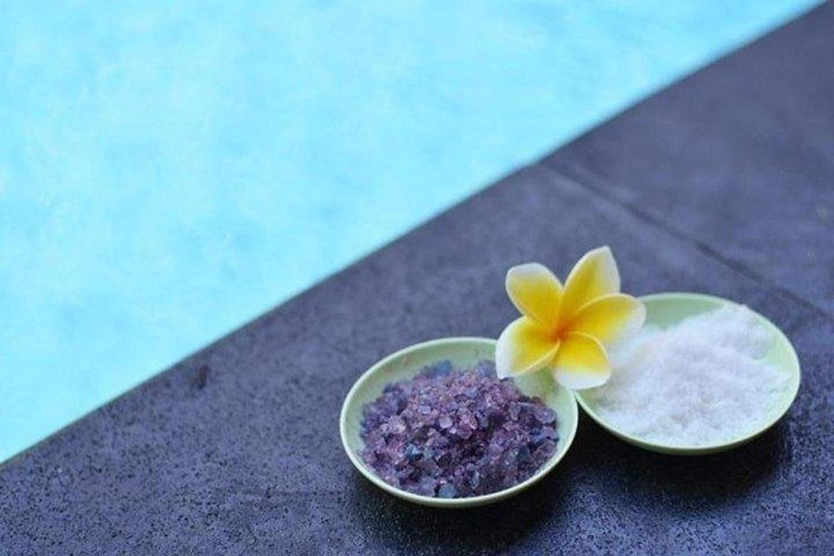 two bowls with a flower in them on the floor