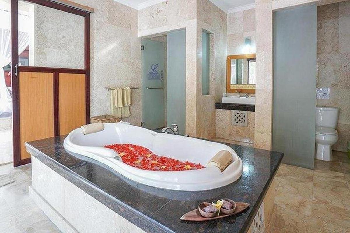 a large bath tub sitting on a counter in a bathroom