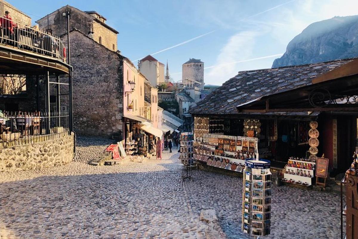 a street in a town with buildings and shops